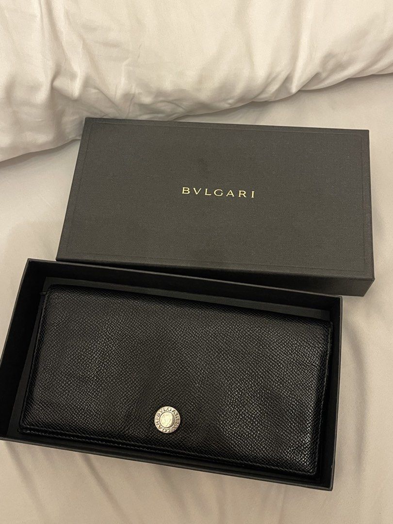 BVLGARI Black Leather Long Wallet with Box (Category: Luxury Bags & Wallets) located in Marilao. Submitted by wardrovearchives (Listing ID 1458023911, Image 1). Description: - Authentic BVLGARI long wallet - Black textured leather - Comes with original BVLGARI box - Classic design with iconic BVLGARI logo detail - Plenty of space for cards and cash - Great for everyday use.