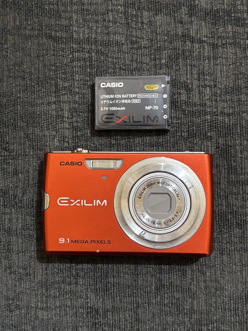 Casio EXILIM 9.1 Megapixels Orange Digital Camera (Category: Cameras) located in Manila. Submitted by dumpanddeclutter (Listing ID 1457963236, Image 2). Description: Casio Exilim EX-Z250 9.1 megapixel CCD sensor flash, zoom, mic, all buttons working ‼️issues‼️ vignette, but display still visible, output not affected at inclusion: unit battery strap.