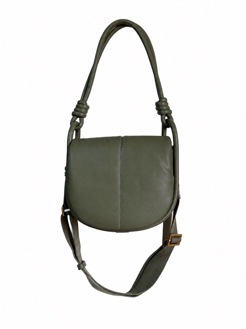 Charles & Keith Olive Green Knot Handle Shoulder Bag (Category: Shoulder Bags) located in Bacoor. Submitted by sofaritsalright (Listing ID 1457973462, Image 1). Description: - Bought for 3859 - Olive green shoulder bag from Charles & Keith. - Features a stylish knotted handle. - Includes a detachable strap for versatility. - Chic curved shape with subtle front stitching. - Brand name embossed on the front. - Ideal for everyday wear and tear..