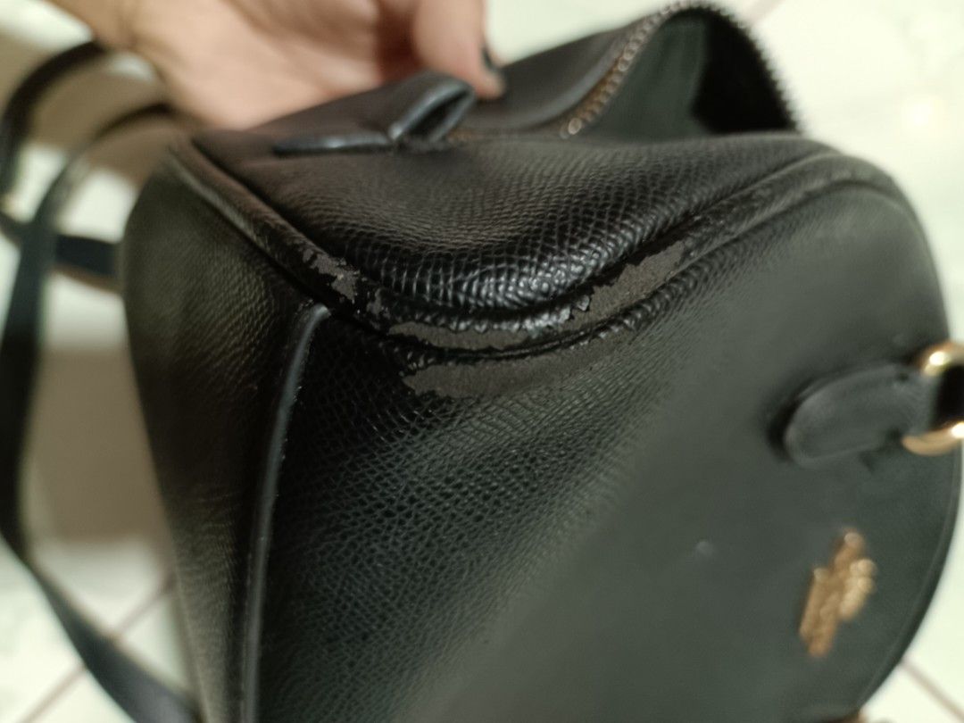 Coach Black Leather Mini Dome Satchel two way Bag (Category: Luxury Bags & Wallets) located in Manila. Submitted by caaths_collection (Listing ID 1458075040, Image 3). Description: - Black Coach Mini Dome Satchel - Versatile: Wear as a crossbody or carry by the top handles - Elegant gold hardware details - Secure zipper closure - Clean and spacious interior - Ideal for everyday use - preloved - AS IS.