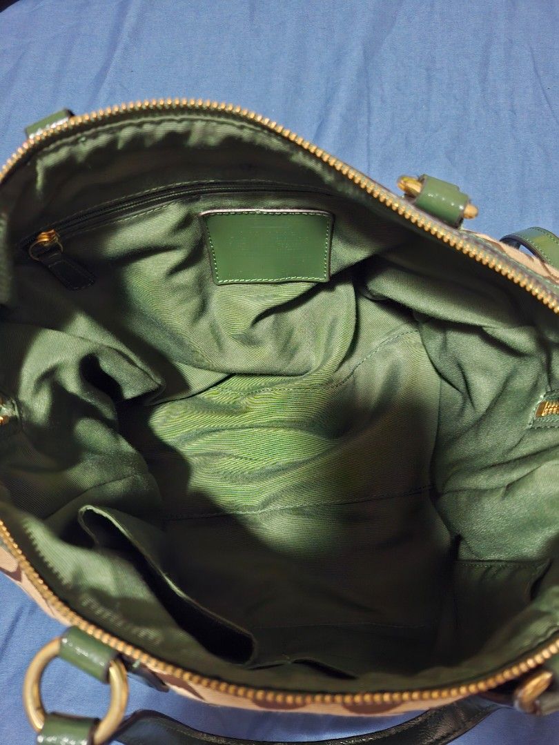 COACH Canvass Snake skin design (Category: Luxury Bags & Wallets) located in Manila. Submitted by yanakolekzione (Listing ID 1458060199, Image 3). Description: - Classic Coach monogram canvas tote - with extra strap - Stylish green patent leather trim and handles - Green snake canvass design - Interior pockets for organization - Secure zipper closure - Elegant gold-tone hardware - Ideal for everyday use.
