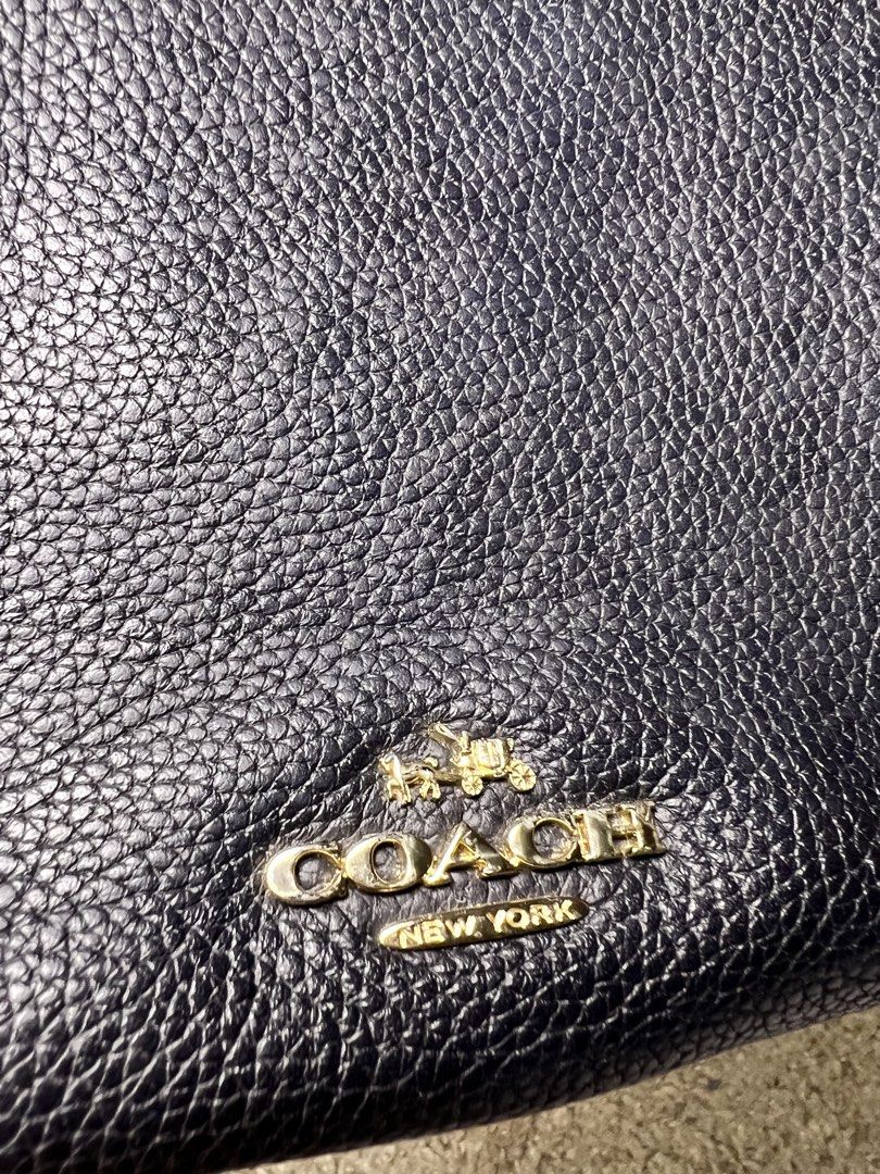 Coach Pebbled Leather Shoulder Bag (Category: Luxury Bags & Wallets) located in Mabalacat. Submitted by roseique2600 (Listing ID 1457939535, Image 3). Description: - Navy blue pebbled leather Coach shoulder bag - Gold hardware details - Secure zipper closure - Spacious interior, ideal for daily essentials - Great everyday bag.