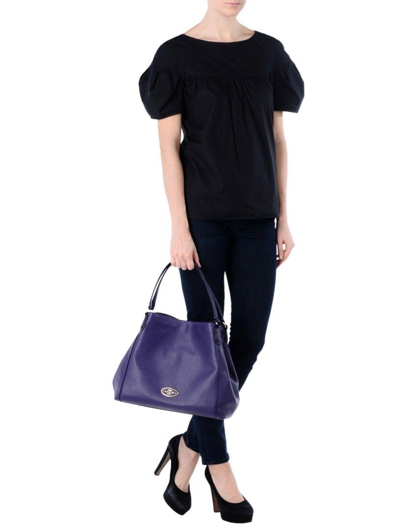 Coach Pebbled Leather Shoulder Bag - Deep Purple (Category: Luxury Bags & Wallets) located in Iloilo. Submitted by fromthebins.ilo2 (Listing ID 1458042200, Image 2). Description: - Coach deep purple pebbled leather shoulder bag - Spacious interior with a zippered compartment - Silver hardware and Coach logo on the front - Includes Coach hangtag - Perfect for everyday or evening use - Minor wear on bottom corner -all details posted MOP:Gcash/Bank 