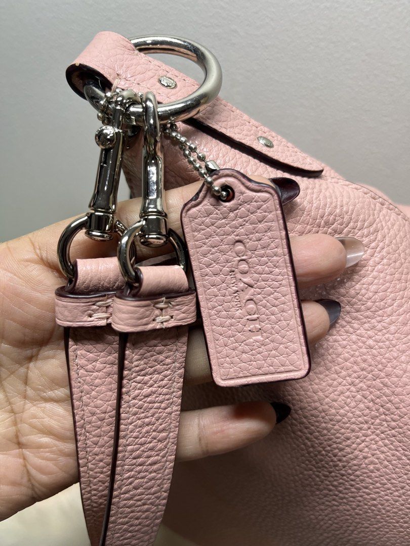 Coach Pink Pebbled Leather Shoulder Bag (Category: Luxury Bags & Wallets) located in Manila. Submitted by sakurumifinds2809 (Listing ID 1457966252, Image 2). Description: - Coach shoulder bag - Lovely light pink color - Genuine pebbled leather - Silver hardware details - Secure zipper closure - Adjustable strap with buckle - Spacious interior - Ideal for everyday use.