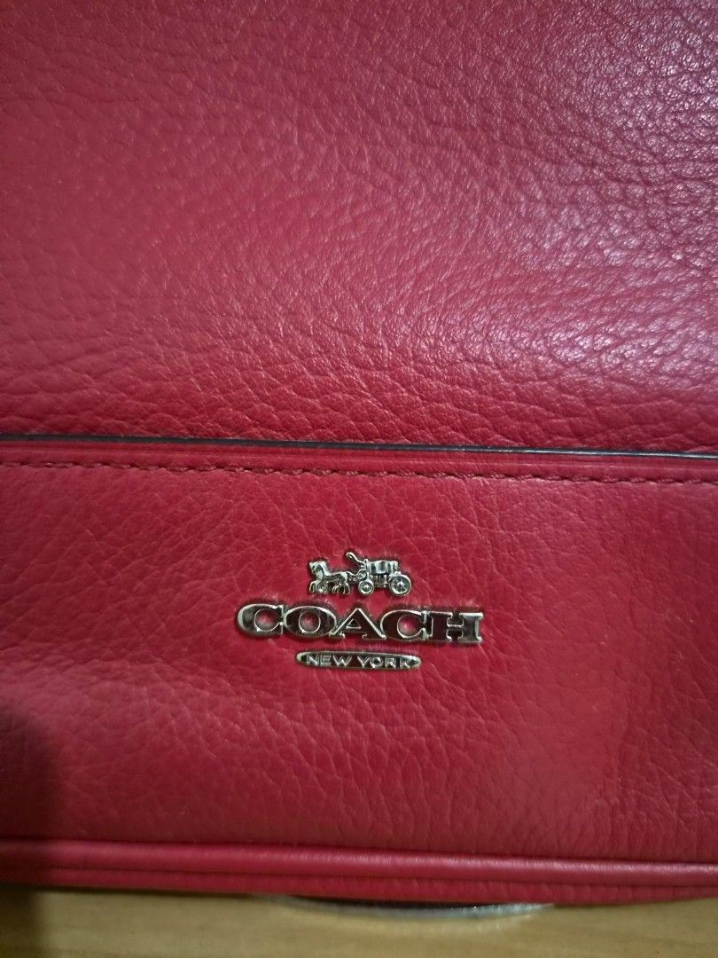 Coach Red Leather Shoulder Bag with Chain Strap (Category: Luxury Bags & Wallets) located in Paranaque City. Submitted by regf_01 (Listing ID 1458078868, Image 3). Description: Preloved 100% authentic chic red leather Coach bag with versatile silver chain and leather straps. Top zipper closure, fabric lining, and interior pocket. Embossed logo. Perfect for daily use! pls see very minimal issue on last pic.