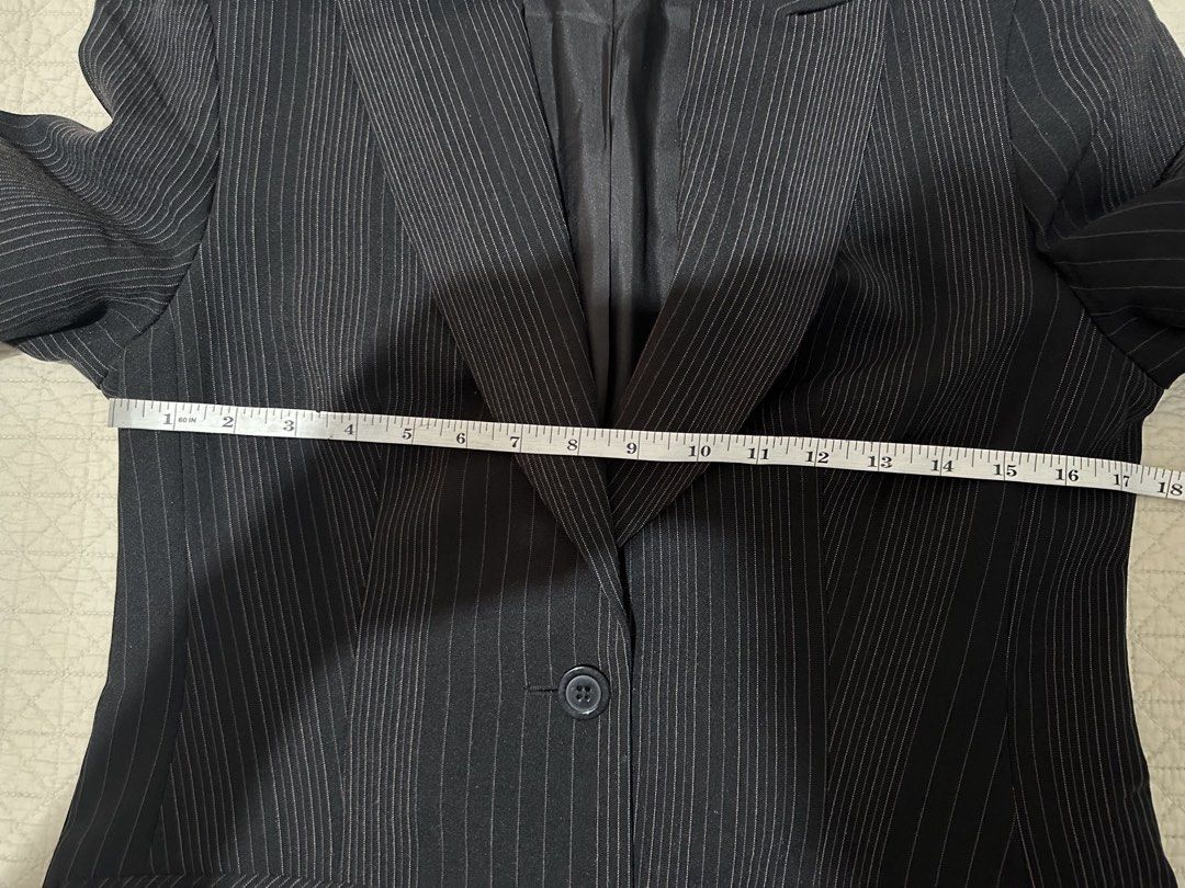 Dark Pinstripe Blazer with Two Buttons (Category: Coats, Jackets and Outerwear) located in Subic. Submitted by ruffa_assorted_item (Listing ID 1457951056, Image 3). Description: - Classic dark blazer - Subtle pinstripe pattern - Two-button front closure - Functional front pockets - Fully lined interior - Versatile for formal and casual styling.