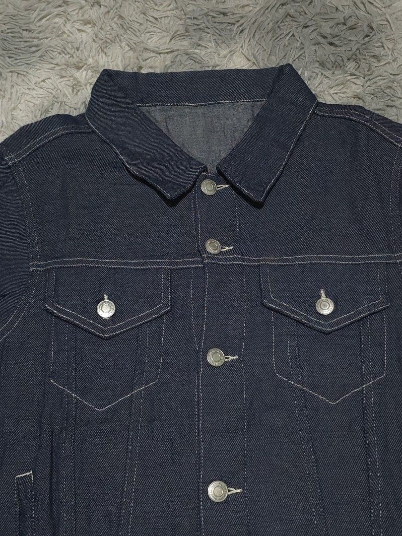 Dark Wash Denim Jacket (Category: Coats, Jackets and Outerwear) located in Abulug. Submitted by humanwhosellthings (Listing ID 1458096149, Image 3). Description: - Classic dark wash denim jacket ✅️23W x 26.5L - Button-up front - Two chest pockets - Two side pockets - Button cuffs on sleeves - Simple, timeless style - Great for layering.