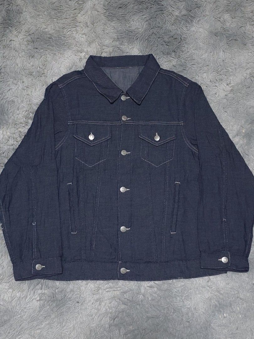 Dark Wash Denim Jacket (Category: Coats, Jackets and Outerwear) located in Abulug. Submitted by humanwhosellthings (Listing ID 1458096149, Image 1). Description: - Classic dark wash denim jacket ✅️23W x 26.5L - Button-up front - Two chest pockets - Two side pockets - Button cuffs on sleeves - Simple, timeless style - Great for layering.