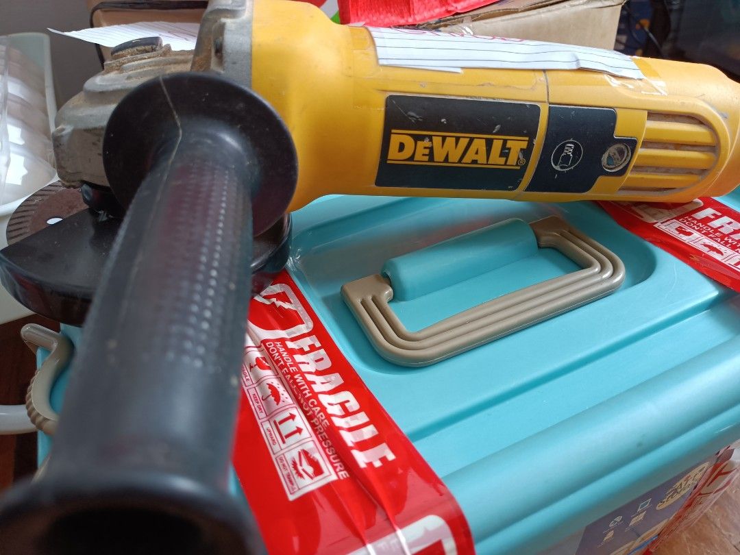 DEWALT Angle Grinder with Cutting Disc (Category: Construction Tools & Equipment) located in Manila. Submitted by ilovesupersale (Listing ID 1457969597, Image 2). Description: - Yellow DEWALT angle grinder - Includes cutting disc - Side handle for improved grip - Power cord included - Ready for your projects - Shows minor dust from previous use take all disc 3 pre-loved 2 brandnew .