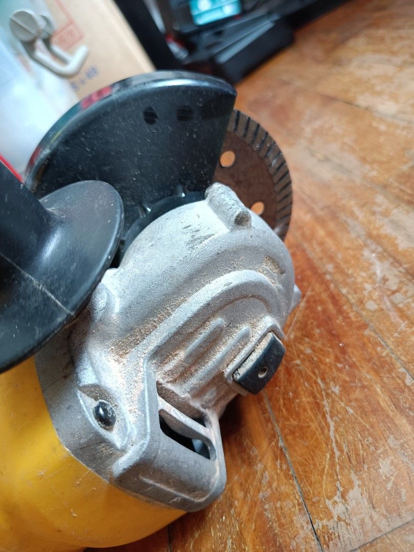 DEWALT Angle Grinder with Cutting Disc (Category: Construction Tools & Equipment) located in Manila. Submitted by ilovesupersale (Listing ID 1457969597, Image 3). Description: - Yellow DEWALT angle grinder - Includes cutting disc - Side handle for improved grip - Power cord included - Ready for your projects - Shows minor dust from previous use take all disc 3 pre-loved 2 brandnew .
