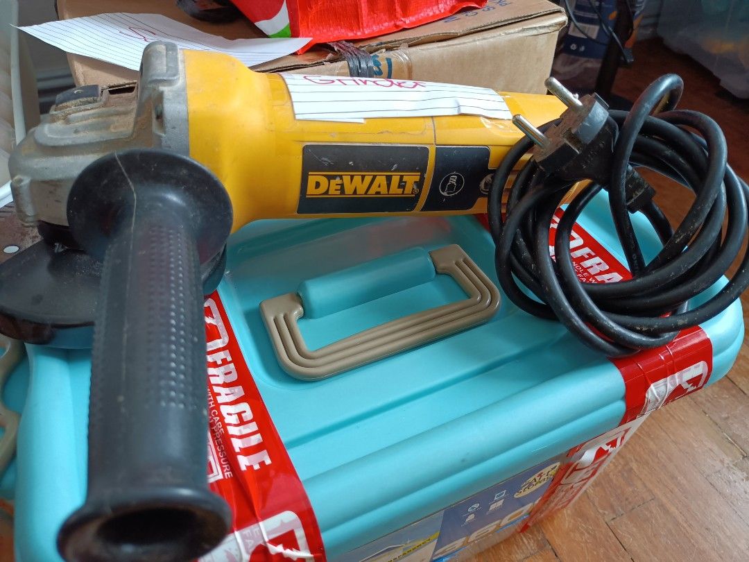 DEWALT Angle Grinder with Cutting Disc (Category: Construction Tools & Equipment) located in Manila. Submitted by ilovesupersale (Listing ID 1457969597, Image 1). Description: - Yellow DEWALT angle grinder - Includes cutting disc - Side handle for improved grip - Power cord included - Ready for your projects - Shows minor dust from previous use take all disc 3 pre-loved 2 brandnew .