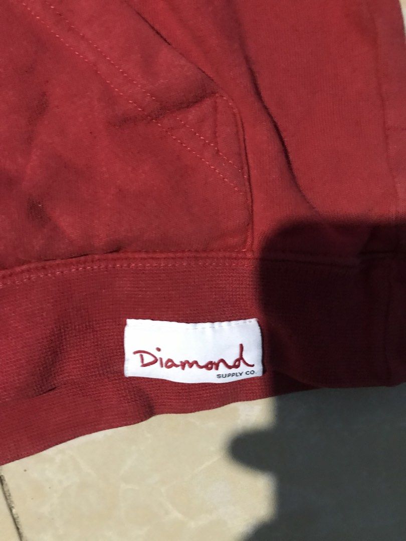 Diamond Supply Co. Red Hoodie (Category: Hoodies) located in Manila. Submitted by rarecloud.b05bda (Listing ID 1458025807, Image 2). Description: - Authentic Diamond Supply Co. red hoodie - Features iconic diamond logo graphic on the front - Comfortable kangaroo pocket - Adjustable drawstring hood - Ideal for everyday casual wear 19x20.