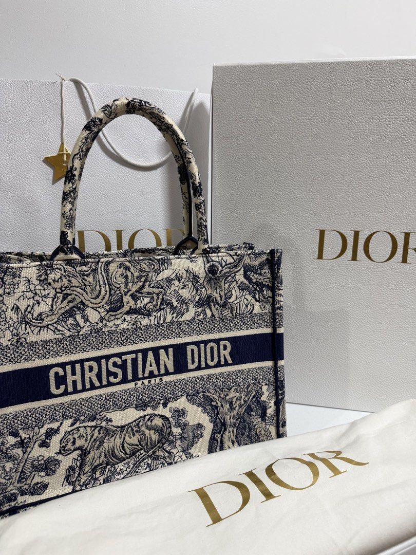 Dior Book Tote (Complete Inclusions) (Category: Luxury Bags & Wallets) located in Caloocan City. Submitted by umsph (Listing ID 1457968911, Image 2). Description: Dior Book Tote Condition: Like New, only used once Purchased in Europe Complete with: - box - paper bag - dust bag - cards Meet up in Alabang, Makati, BGC Negotiable!.