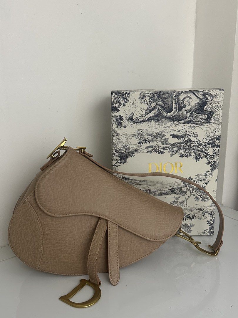 Dior Saddle Bag Beige Leather Gold Hardware (Category: Luxury Bags & Wallets) located in Mabalacat. Submitted by itsaki (Listing ID 1457958862, Image 1). Description: - Christian Dior Saddle Bag - Color: Beige - Condition: Great, barely used - Hardware: Gold - Includes: Original box, dust bag, authenticity cards, tag, extra strap - Comes with: Christian Dior strap.