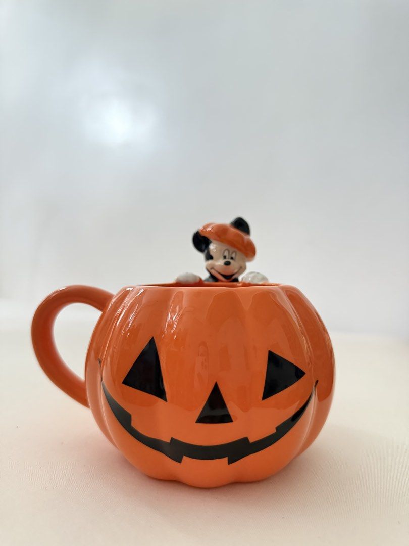 Disney Mickey Mouse Pumpkin Mug (Category: Coffee & Tea Tableware) located in Quezon City. Submitted by fragilebabies (Listing ID 1457998523, Image 1). Description: - Cute Mickey Mouse pumpkin mug - Perfect for Halloween or year-round Disney fans - Orange ceramic with a jack-o'-lantern face - Mickey peeking out from the top, wearing a little orange beret - Great for coffee, tea, or hot chocolate - Fun addition to any kitchen Disclaimer: Please be