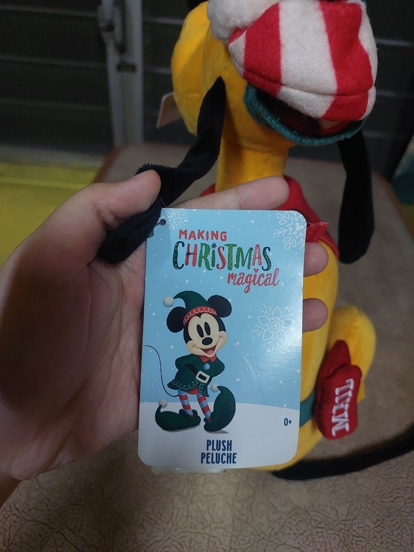 Disney Store Pluto Christmas Plush Toy (Category: Plushies & Soft Toys) located in Manila. Submitted by newdeer.eaa070 (Listing ID 1457967284, Image 3). Description: - Cute Disney Store Pluto plush toy - Dressed in a festive Christmas outfit - Features 'MAIL' details on paws - Includes 'To: Santa North Pole' tag - Soft and cuddly - Perfect for Disney fans and holiday decor.