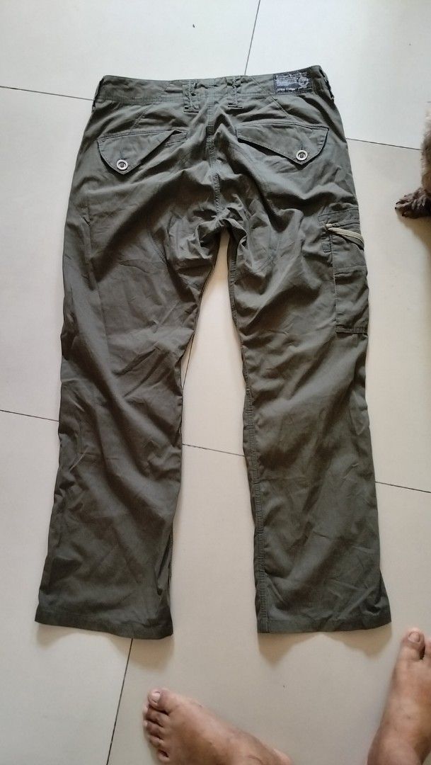 EDWIN Exclusive Vintage Model Cargo Pants Size M (Category: Jeans) located in Angeles City. Submitted by mightywhale_13072f (Listing ID 1457914798, Image 2). Description: - Brand: EDWIN - Color: Olive Green - Style: Cargo Pants - Fit: Relaxed - Size: M (Waist 78cm, Hips 96cm) - Features: Multiple pockets with zip and button closures - Ideal for: Casual wear - Condition: Please check photos for details.