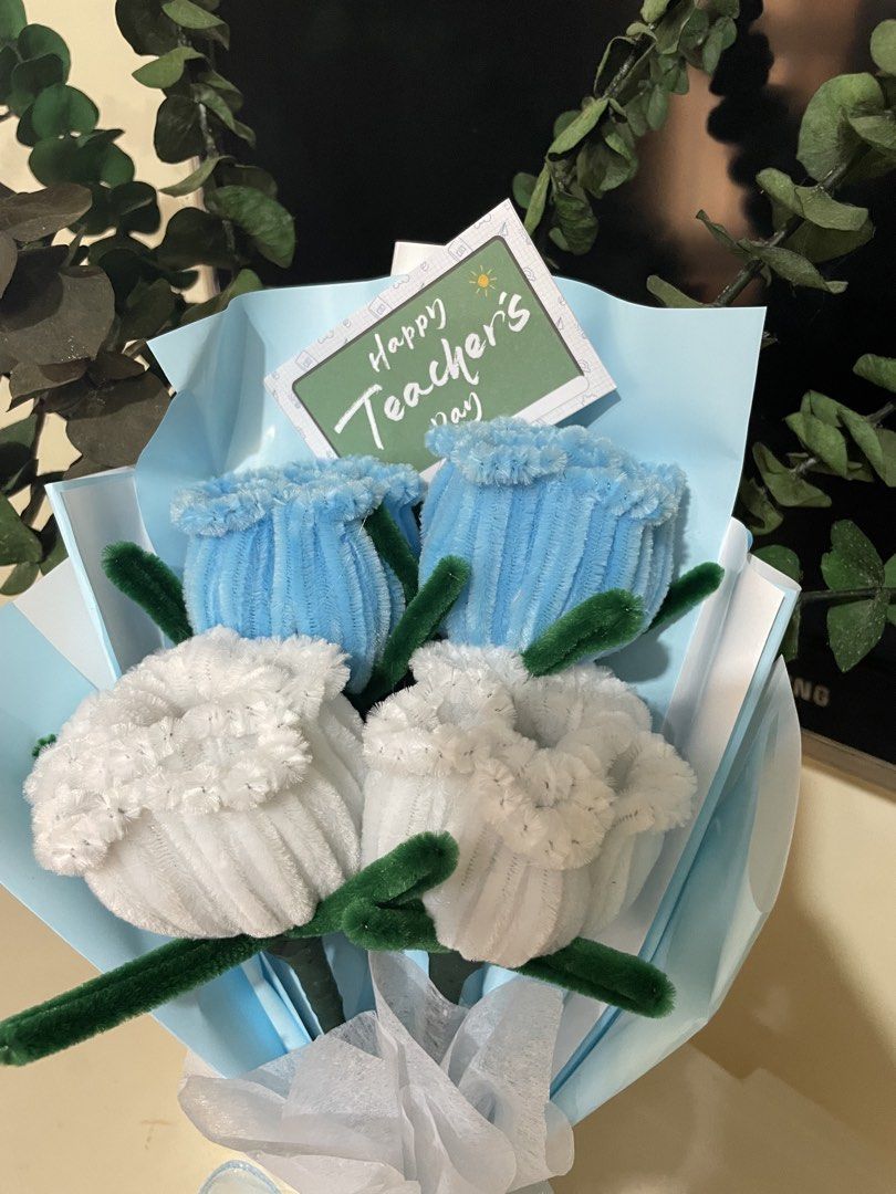 Flower Bouquets (Category: Flowers & Bouquets) located in Rizal. Submitted by arlynazanion16 (Listing ID 1457927047, Image 3). Description: This is a handmade fuzzy wire (pipe cleaner) tulip flower bouquet wrapped in light blue paper with a "Happy Teacher's Day" tag..