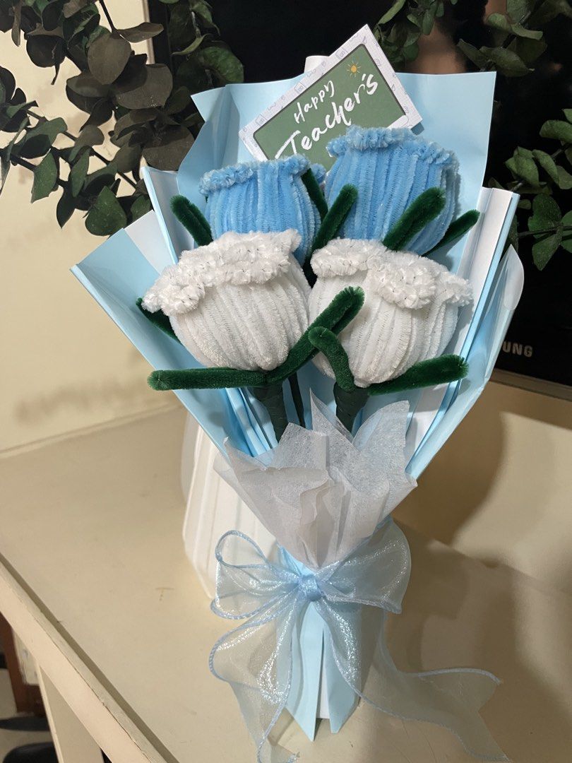 Flower Bouquets (Category: Flowers & Bouquets) located in Rizal. Submitted by arlynazanion16 (Listing ID 1457927047, Image 2). Description: This is a handmade fuzzy wire (pipe cleaner) tulip flower bouquet wrapped in light blue paper with a "Happy Teacher's Day" tag..