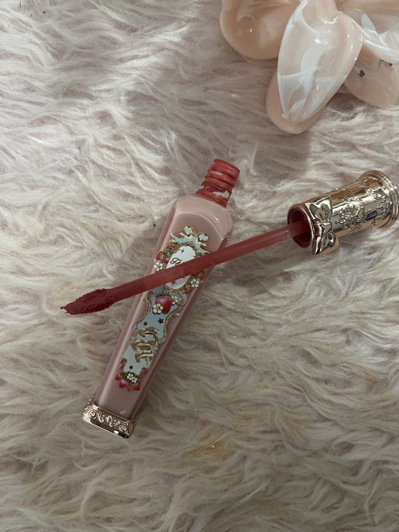 Flower Knows Strawberry Rococo Lip Gloss (Category: Makeup) located in Rizal. Submitted by cinnamroll (Listing ID 1458005108, Image 2). Description: - Brand: Flower Knows - Product: Strawberry Rococo Lip Gloss - Shade: Berry Red - Condition: Swatched once on hand - Packaging: Beautiful and highly detailed - Features: Adds a lovely pop of color - Includes: Original cap.