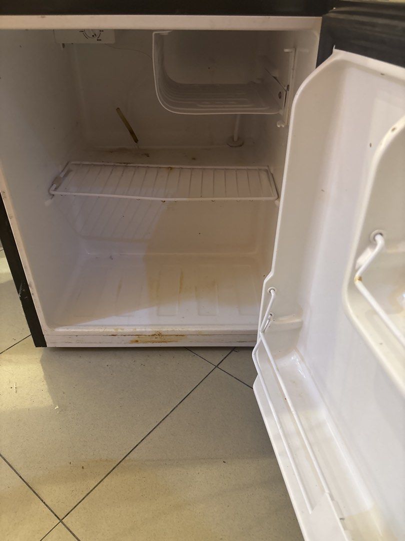 Fujidenzo Mini Fridge (Category: Refrigerators and Freezers) located in San Juan City. Submitted by tropicbling (Listing ID 1457996291, Image 2). Description: - Fujidenzo mini fridge - Silver exterior - Interior shelves and door compartments - Exterior shows some scuffs and marks - Interior has some staining - Works well - needs cleaning - no history of repair.