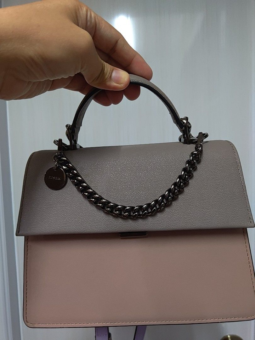 Rosa K Mini Crossbody Bag (Category: Luxury Bags & Wallets) located in Cagayan de Oro. Submitted by ps1030 (Listing ID 1457987671, Image 1). Description: - Authentic Rosa K mini crossbody bag - Versatile chain strap and top handle - Chic grey and pink exterior - Includes original Furla charm - Ideal for carrying daily essentials.