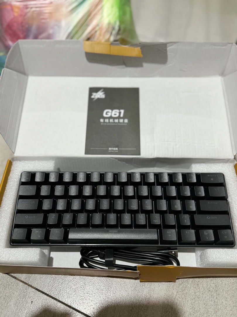 G61 Mechanical Keyboard (Category: Computer Keyboard) located in Quezon City. Submitted by johnmdv (Listing ID 1457941678, Image 2). Description: - Zifoo G61 Mechanical Keyboard - Compact 60% Layout - Color: Black - Connectivity: USB-C (cable included) - Condition: Tested and working well - Includes: Original box and manual - Ideal for: Gaming and typing.