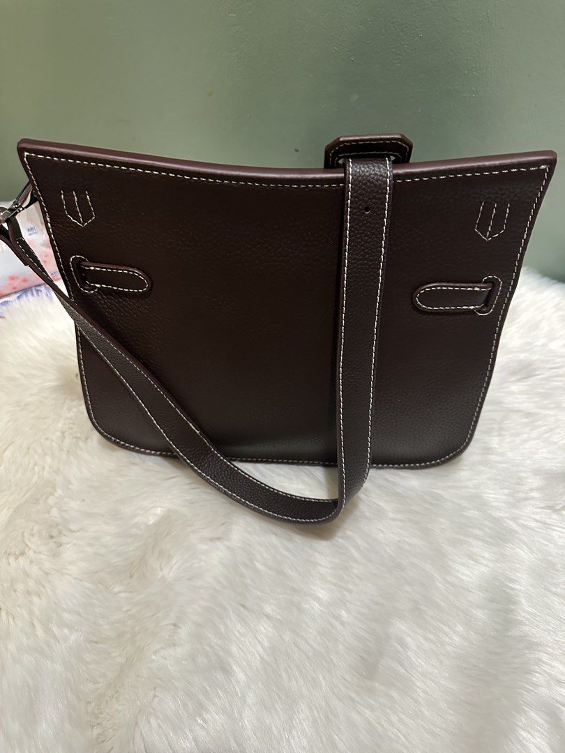 Genuine leather brown bag (Category: Shoulder Bags) located in Paranaque City. Submitted by love1927 (Listing ID 1457994660, Image 2). Description: Up for grabs is my medium size bag made of genuine calf leather in pebble design With silver hardwares complete with dust bag lock and key RFS: not my bag type This is so beautiful in actual Got this as gift and I only use this once on pictorial Height of the bag:9 1/2 inches Length: 10 1/2 inches .