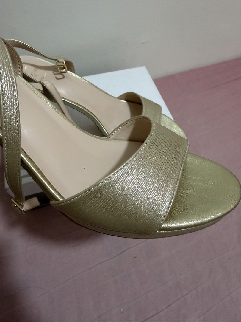 Gibi Gold Heels Sandals (Category: Heels) located in Malabon City. Submitted by pambidgwenn (Listing ID 1457945612, Image 3). Description: Brand New, Never Worn. Selling for 1,500 (Original Price is 1,999) - Gibi gold strappy heels - Slingback style with buckle closure - Comfortable heel height, perfect for events or daily wear - Highly versatile, pairs well with most outfits - Includes original box.