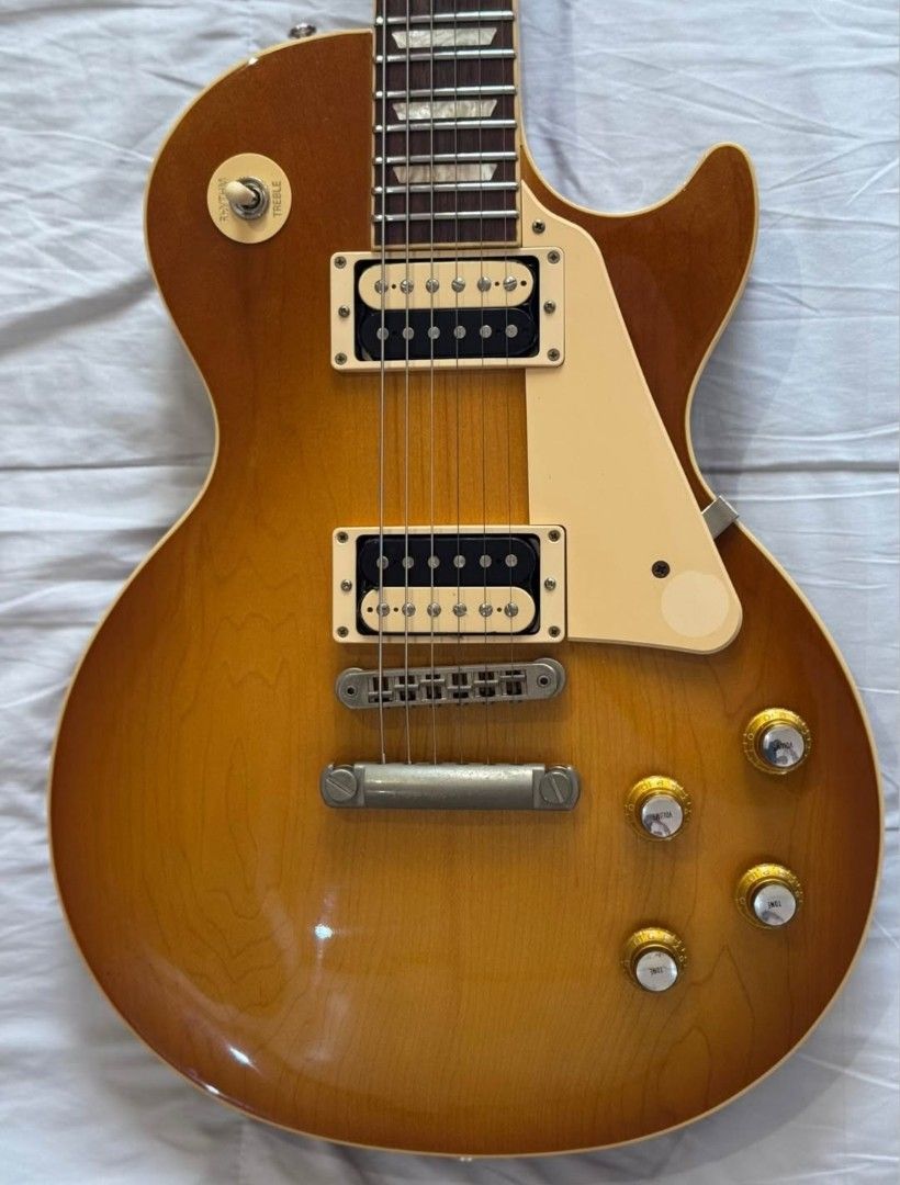 Gibson Les Paul Classic 2021 (w/ case) (Category: Musical Instruments) located in Quezon City. Submitted by writtenbyfire (Listing ID 1457940701, Image 3). Description: Gibson Les Paul Classic 2021 (honey burst finish) with OHSC, strap, wrench and papers Specs: - slim taper neck - modern weight relief - 24.75 scale length - grover tuning keys - tune-o-matic bridge - Gibson 61 burstbuckers set RFS: medical funds Location: Monumento / Quezon City.