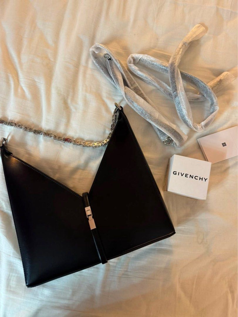 Givenchy Black Gv3 Shoulder Bag (Category: Luxury Bags & Wallets) located in Quezon City. Submitted by tinemarcelo (Listing ID 1457922421, Image 2). Description: - Authentic black Givenchy shoulder bag - Unique geometric design - Silver chain strap - Includes detachable shoulder strap - Versatile for day or night use.