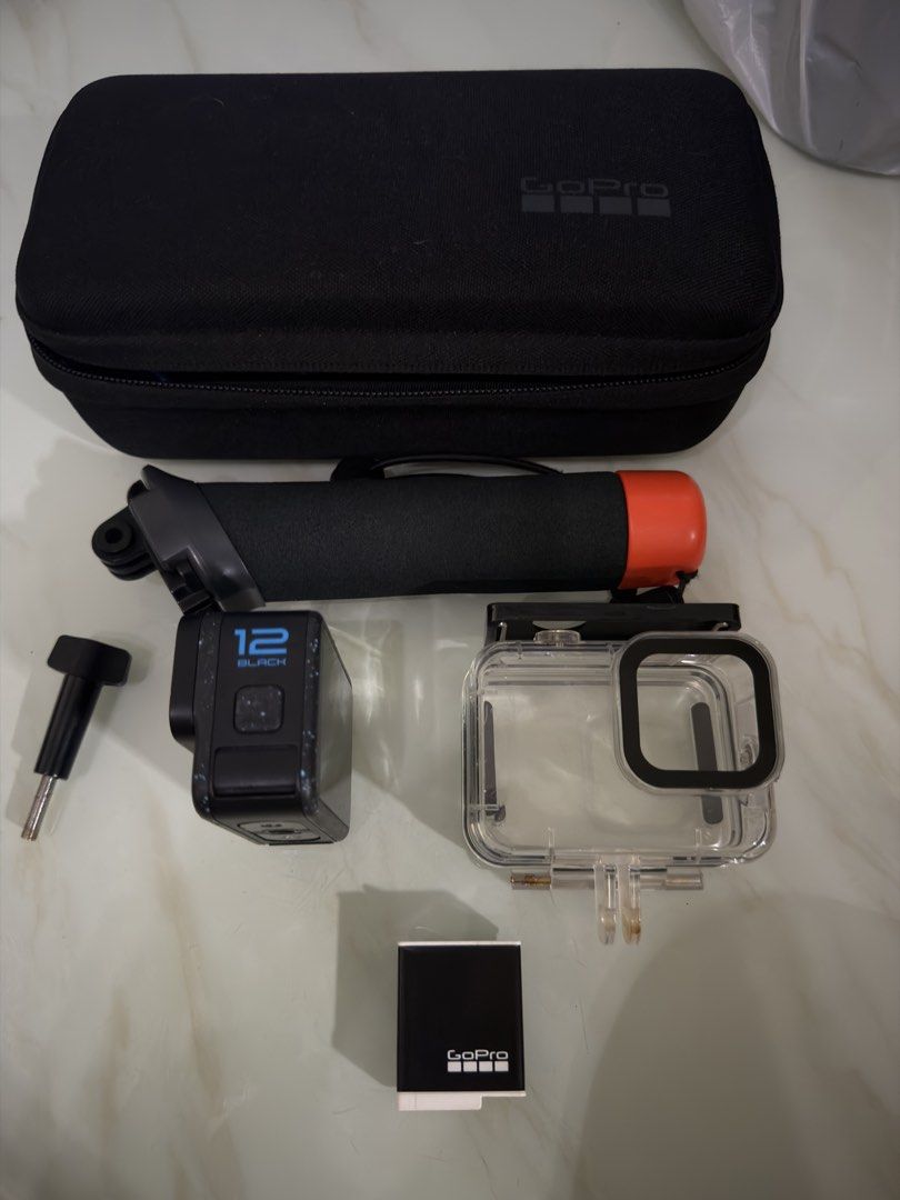GoPro HERO 12 Black Action Camera with Accessories (Category: Cameras) located in Quezon City. Submitted by joeryan_dechavez (Listing ID 1458007669, Image 2). Description: - GoPro HERO 12 Black action camera - Includes carrying case - Floating hand grip for water activities - Waterproof housing for underwater shots - Original battery for extended recording - Ideal for sports, travel, and capturing all your adventures.