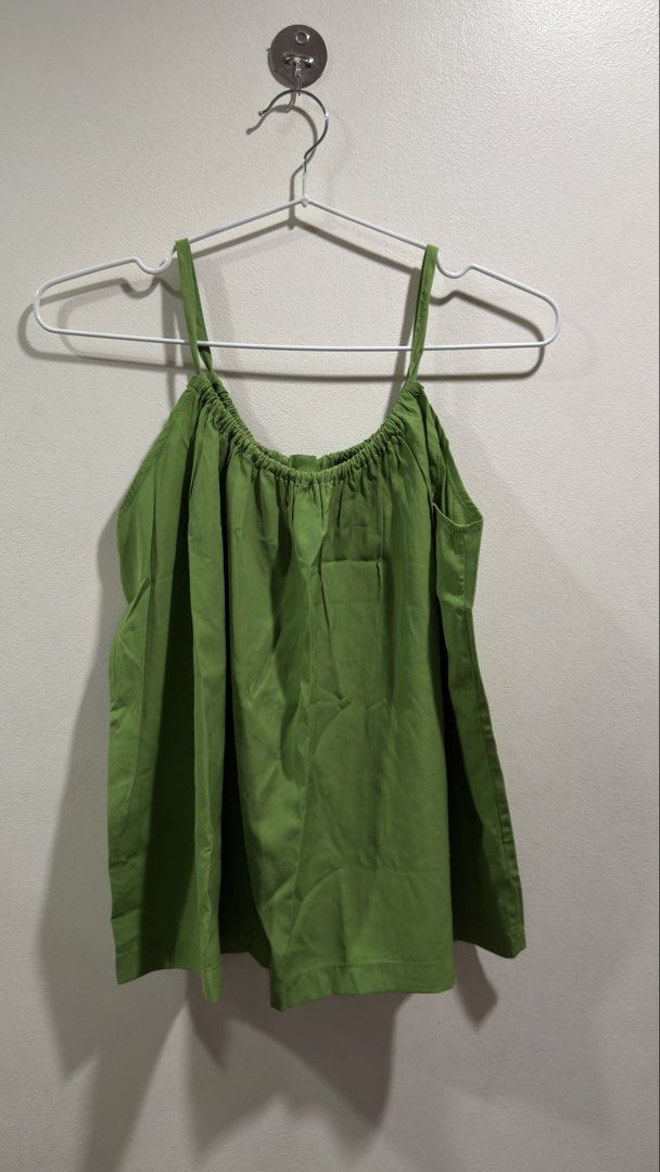 Green Cami Top with Tie Back (Category: Sleeveless) located in Cebu City. Submitted by ngl.prelovedstuff (Listing ID 1457911521, Image 1). Description: - Adorable green cami top - Adjustable spaghetti straps for a comfortable fit - Ruched neckline with elastic detail - Back tie closure for a customizable fit - Lightweight fabric, ideal for warm weather - Versatile for dressing up or down - can fit up to medium size.