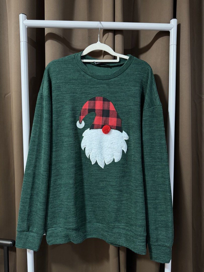 Green Christmas Gnome Sweater (Category: Coats, Jackets and Outerwear) located in Manila. Submitted by noblecrystal-c256 (Listing ID 1458049021, Image 1). Description: - Cozy green sweater perfect for Christmas! - Features an adorable gnome graphic with a red & black buffalo plaid hat and fluffy white beard. - Classic long sleeves and crew neck design. - Ideal for holiday parties or everyday casual wear. - Approximate measurements: 22 inches pit 