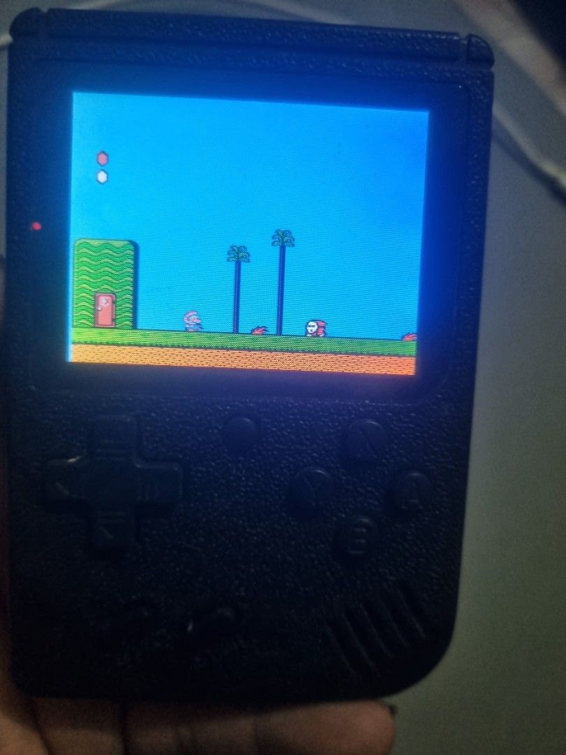 Handheld retro gaming console (Category: Others) located in Silang. Submitted by samflores2k4t7 (Listing ID 1457943847, Image 2). Description: for sale Handheld retro gaming console 168 in 1 with charger.