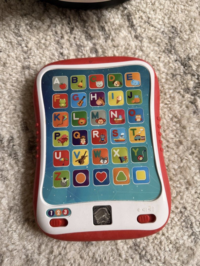 i-Fun educational tablet (Category: Educational & Learning Toys) located in Rizal. Submitted by karlaquijanomd (Listing ID 1457929896, Image 1). Description: - Interactive learning tablet for toddlers - Teaches letters, numbers, and animals - Features different fun and educational modes - Red and white design with colorful buttons - Ideal for early exploration and learning - Requires batteries.