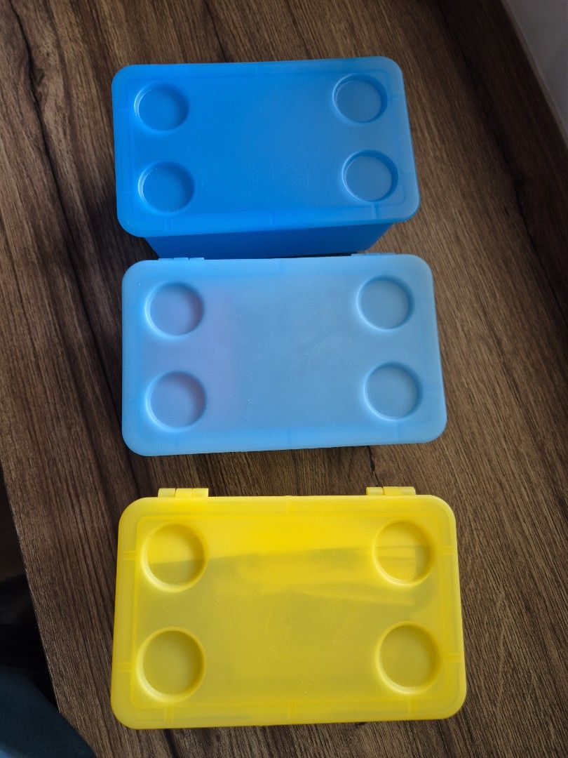 Ikea stackable storage boxes 3 pcs (Category: Storage Boxes & Baskets) located in Singapore. Submitted by mg_sell_buy (Listing ID 1457947822, Image 2). Description: - Set of 3 Ikea storage boxes (17 × 10 cms) - Includes two blue boxes and one yellow box - features a convenient detachable hinged lid - Ideal for organizing small items - Adds a touch of color to your space.