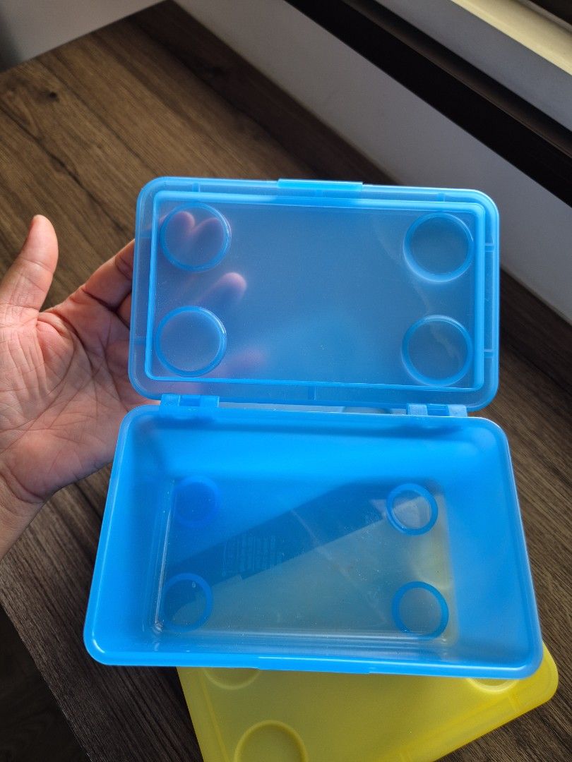 Ikea stackable storage boxes 3 pcs (Category: Storage Boxes & Baskets) located in Singapore. Submitted by mg_sell_buy (Listing ID 1457947822, Image 3). Description: - Set of 3 Ikea storage boxes (17 × 10 cms) - Includes two blue boxes and one yellow box - features a convenient detachable hinged lid - Ideal for organizing small items - Adds a touch of color to your space.