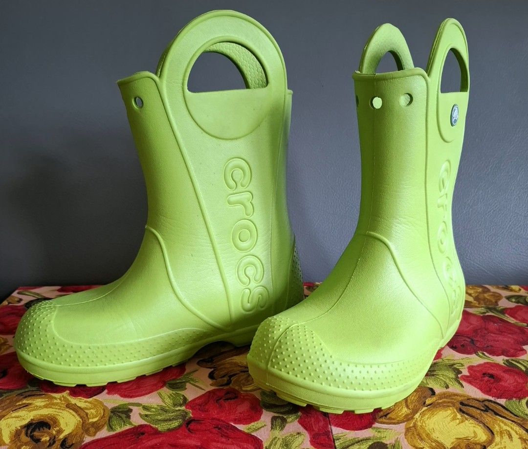 Kids Crocs Rain Boots Lime Green Size 1 (Category: Babies & Kids Fashion) located in Don Carlos. Submitted by PphiXi_Finds (Listing ID 1457981052, Image 2). Description: - Green Crocs rain boots for kids - Size 1 - Easy pull-on handles for quick wear - Textured toe and sole for excellent grip - Made in Vietnam - Ideal for rainy days and puddle jumping adventures - See last 2 photos for issues .