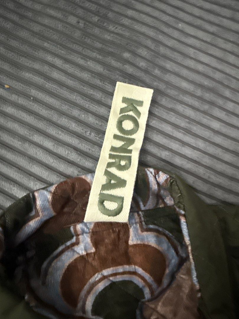 Konrad Quilted Reversible Jacket Olive Green (Category: Community) located in Angeles City. Submitted by migs_font29 (Listing ID 1458003175, Image 2). Description: - Konrad reversible jacket - Side 1: Olive green with quilted diamond pattern - Side 2: Brown, blue, and green abstract print - Closure: Zipper - Style: Great for layering.