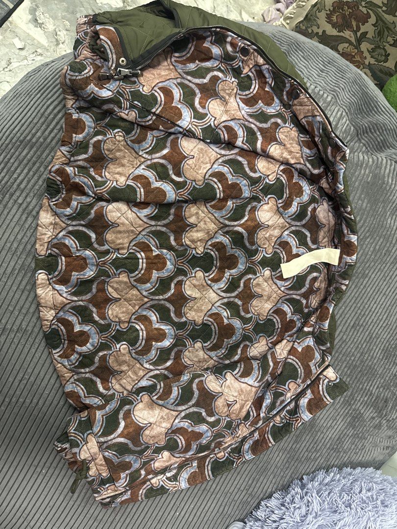 Konrad Quilted Reversible Jacket Olive Green (Category: Community) located in Angeles City. Submitted by migs_font29 (Listing ID 1458003175, Image 3). Description: - Konrad reversible jacket - Side 1: Olive green with quilted diamond pattern - Side 2: Brown, blue, and green abstract print - Closure: Zipper - Style: Great for layering.