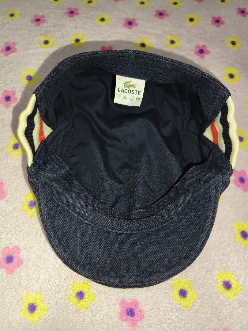 Lacoste Navy Blue Flat Cap Hat (Category: Caps & Hats) located in Bulacan. Submitted by THA_D_THRIFT (Listing ID 1458072865, Image 3). Description: - Brand: Lacoste - Color: Navy Blue - Style: Flat Cap - Features: Iconic crocodile logo on the side, striped detailing on the back - Size: Free Size - Occasion: Casual wear 800 + SF.
