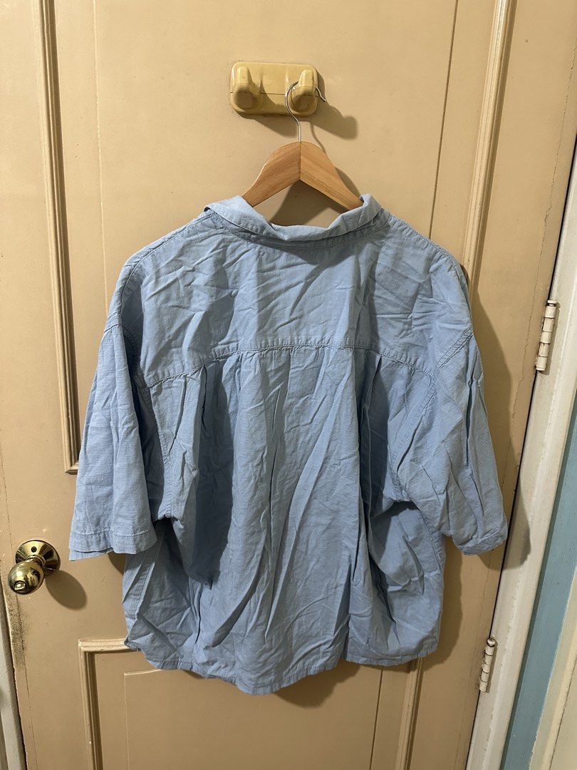Light Blue Short Sleeve Button Up Shirt (Category: Tshirts & Polo Shirts ) located in Manila. Submitted by thriftchup (Listing ID 1457983471, Image 2). Description: - Light blue short sleeve button-up shirt - Textured fabric for a unique look - Features a convenient chest pocket - Relaxed fit for comfort - Ideal for casual outfits - Versatile and easy to style.