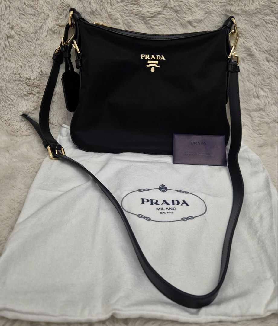 Like New Prada Tessuto Nylon Small Sling Bag (Category: Luxury Bags & Wallets) located in Manila. Submitted by mrsmdxbseller (Listing ID 1458093677, Image 1). Description: Onhand in 🇵🇭 Tessuto Nylon Canvas Like New Condition Comes with dustbag, cards and paperbag Selling low!.