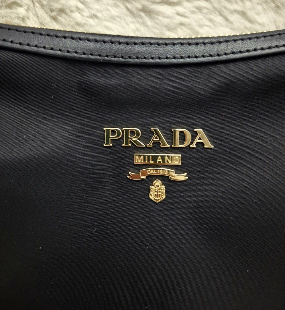 Like New Prada Tessuto Nylon Small Sling Bag (Category: Luxury Bags & Wallets) located in Manila. Submitted by mrsmdxbseller (Listing ID 1458093677, Image 2). Description: Onhand in 🇵🇭 Tessuto Nylon Canvas Like New Condition Comes with dustbag, cards and paperbag Selling low!.