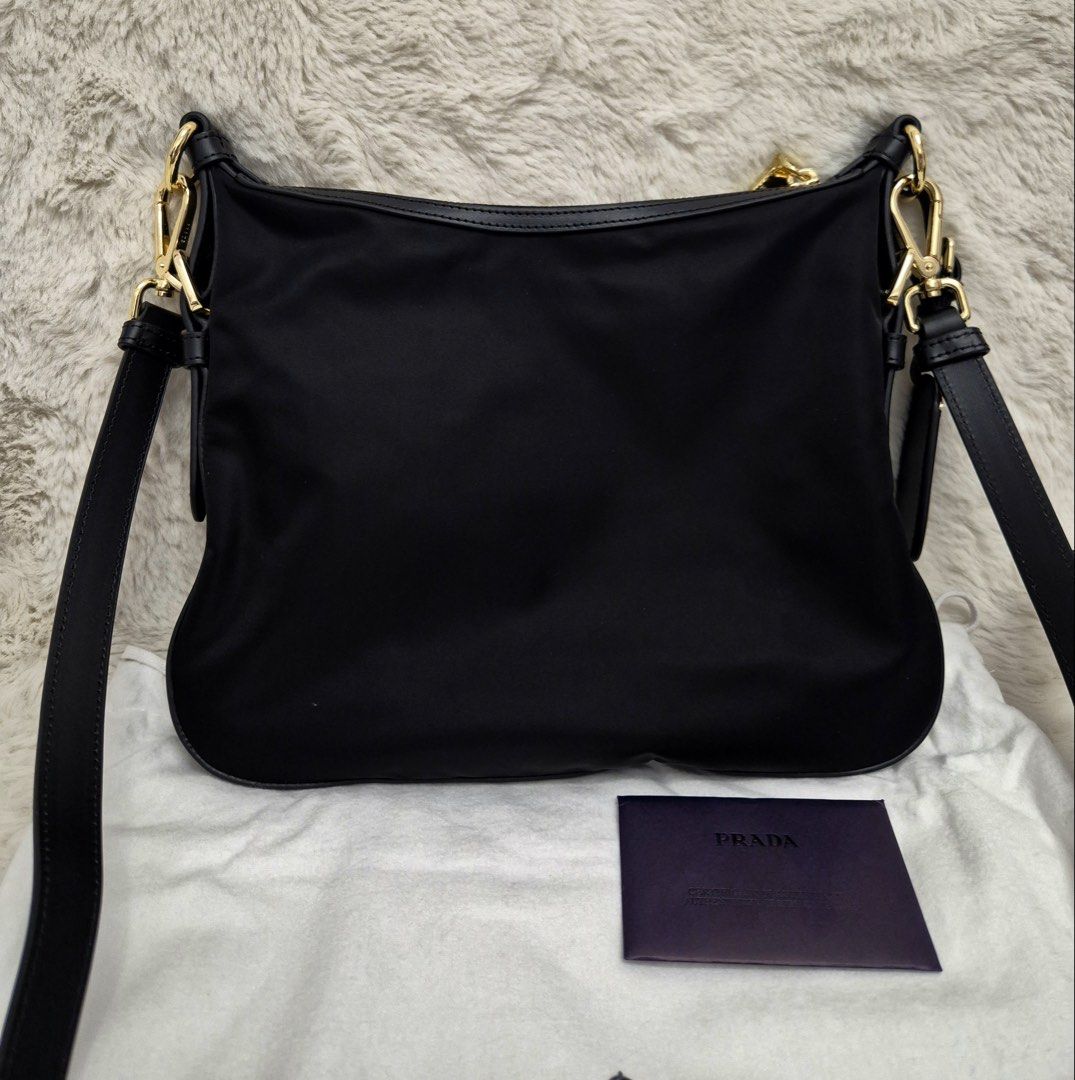 Like New Prada Tessuto Nylon Small Sling Bag (Category: Luxury Bags & Wallets) located in Manila. Submitted by mrsmdxbseller (Listing ID 1458093677, Image 3). Description: Onhand in 🇵🇭 Tessuto Nylon Canvas Like New Condition Comes with dustbag, cards and paperbag Selling low!.