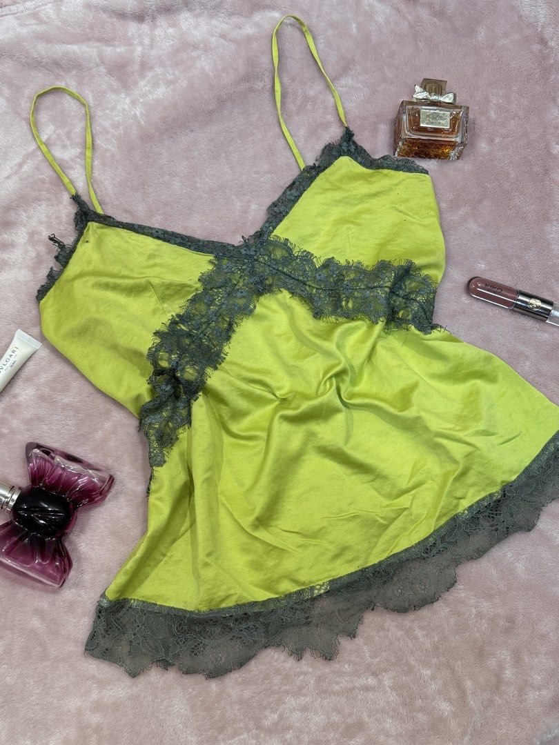 Lime Green Lace Trim Cami Top (Category: Sleeveless) located in Manila. Submitted by livelaughlovejay (Listing ID 1458064388, Image 1). Description: - Cute lime green cami top - Features delicate grey lace trim - Adjustable straps for a perfect fit - Made from silky, smooth material - Ideal for layering or wearing on its own - Perfect for a night out or casual lounging.