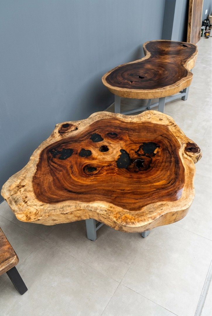 Live Edge Walnut Coffee Table with Black Resin Inlay (Category: Tables & Sets) located in Pasig City. Submitted by casambhomedecors (Listing ID 1458003853, Image 2). Description: - Unique live edge coffee table - Made from premium walnut wood - Features natural wood grain with black resin filling voids - Irregular, live tabletop edge - Supported by sturdy black metal legs - Perfect statement piece for any living room.