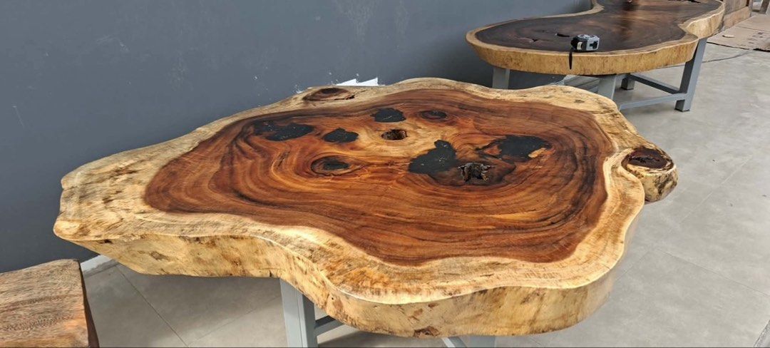 Live Edge Walnut Coffee Table with Black Resin Inlay (Category: Tables & Sets) located in Pasig City. Submitted by casambhomedecors (Listing ID 1458003853, Image 3). Description: - Unique live edge coffee table - Made from premium walnut wood - Features natural wood grain with black resin filling voids - Irregular, live tabletop edge - Supported by sturdy black metal legs - Perfect statement piece for any living room.
