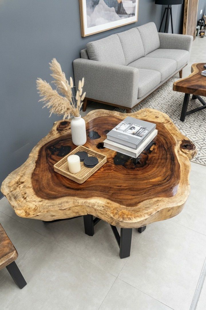Live Edge Walnut Coffee Table with Black Resin Inlay (Category: Tables & Sets) located in Pasig City. Submitted by casambhomedecors (Listing ID 1458003853, Image 1). Description: - Unique live edge coffee table - Made from premium walnut wood - Features natural wood grain with black resin filling voids - Irregular, live tabletop edge - Supported by sturdy black metal legs - Perfect statement piece for any living room.